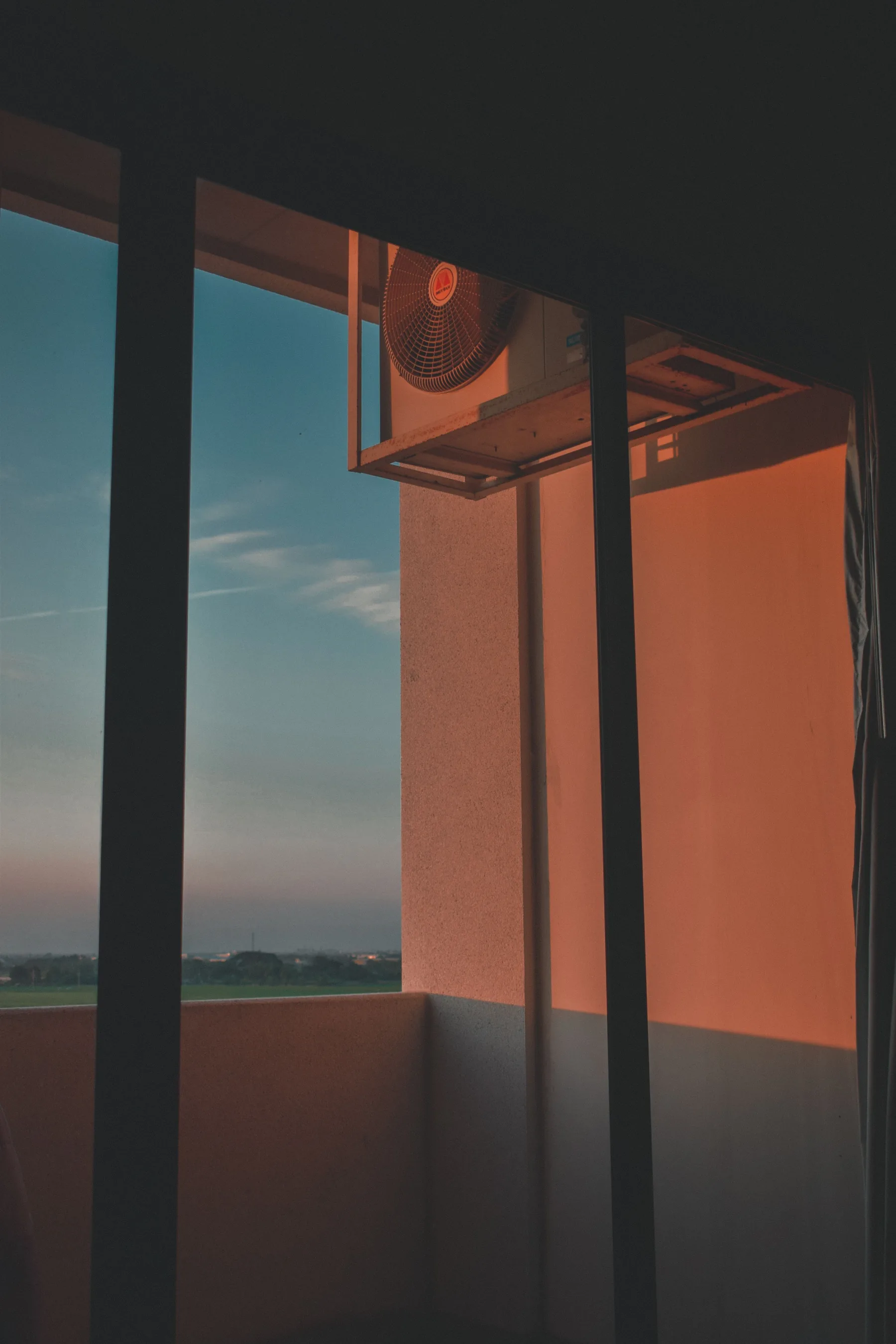 Residential balcony opening with city view at sunrise